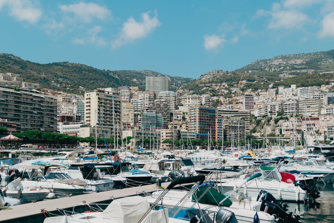 Experience the luxurious yachts and stunning cityscape of Monaco, nestled by the Mediterranean Sea.